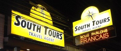 South Tours office signage at night, Patong Beach